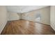 Bright living room with hardwood floors, ceiling fan, and ample natural light with an open staircase at 115 Trickle Dr, Summerville, SC 29483