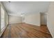 Spacious living room with hardwood floors, ceiling fan, neutral walls, and lots of natural light at 115 Trickle Dr, Summerville, SC 29483