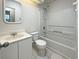 Bright bathroom with a shower-tub combo, classic toilet, and vanity with mirror at 117 Coronet St, Summerville, SC 29483