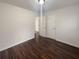 Bedroom showing hardwood floors, a door, and an open entrance to another room at 117 Coronet St, Summerville, SC 29483