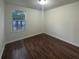 Empty bedroom featuring hardwood floors, one window, and neutral-colored walls at 117 Coronet St, Summerville, SC 29483