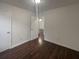 View of a bedroom showcasing beautiful hardwood floors and an open doorway at 117 Coronet St, Summerville, SC 29483