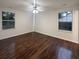 This spacious bedroom features hardwood floors, a ceiling fan, and two large windows at 117 Coronet St, Summerville, SC 29483