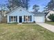 Charming light blue single-story home with black shutters and a well-maintained front lawn at 117 Coronet St, Summerville, SC 29483