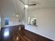 Bright living room featuring hardwood floors, high ceiling, and breakfast bar at 117 Coronet St, Summerville, SC 29483