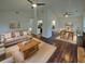 Staged living and dining room with high ceilings, ceiling fans, and hardwood floors at 117 Coronet St, Summerville, SC 29483