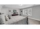 Bright bedroom featuring a window, carpet, and neutral paint color with a dresser and decor at 1173 Triple Crown Court, Mount Pleasant, SC 29429