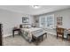 Cozy bedroom with carpet flooring, neutral paint color, and a desk area with decor at 1173 Triple Crown Court, Mount Pleasant, SC 29429