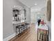 Hallway features modern, neutral decor with views of kitchen and living area at 1173 Triple Crown Court, Mount Pleasant, SC 29429