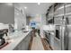 Modern kitchen featuring stainless steel appliances, white countertops, and sleek gray cabinetry at 1173 Triple Crown Court, Mount Pleasant, SC 29429