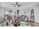 Comfortable living room with ceiling fan, opening to the kitchen and featuring stairs to another level at 1173 Triple Crown Court, Mount Pleasant, SC 29429