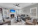 Inviting living room with fireplace, ceiling fan, and access to the outdoor patio at 1173 Triple Crown Court, Mount Pleasant, SC 29429
