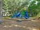 Community playground featuring slides, climbing structures, and various play areas for children in a verdant setting at 1173 Triple Crown Court, Mount Pleasant, SC 29429