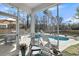 Inviting screened porch overlooking backyard pool for relaxation and entertainment at 1173 Triple Crown Court, Mount Pleasant, SC 29429