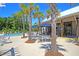 Community pool and patio area surrounded by palm trees offering a relaxing space at 1173 Triple Crown Court, Mount Pleasant, SC 29429
