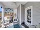 Screened-in porch with cushioned chairs, a ceiling fan, and backyard views at 1173 Triple Crown Court, Mount Pleasant, SC 29429