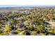 Scenic aerial view of a residential area with numerous houses, green trees, and waterways in the background at 1200 Island View Dr, Mount Pleasant, SC 29464