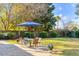 Spacious backyard with a patio area, lush lawn, and mature trees for outdoor enjoyment at 1200 Island View Dr, Mount Pleasant, SC 29464