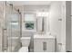 Bathroom with a glass-enclosed shower, white vanity, and a bright, natural light at 1200 Island View Dr, Mount Pleasant, SC 29464