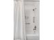 Clean, white bathroom features a shower-tub combo with tiled walls and modern fixtures at 1200 Island View Dr, Mount Pleasant, SC 29464