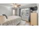 Cozy bedroom features a ceiling fan, a window with blinds, and comfortable furnishings at 1200 Island View Dr, Mount Pleasant, SC 29464