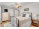 Bedroom with ceiling fan, television, neutral color scheme, and an ornamental iron bed frame at 1200 Island View Dr, Mount Pleasant, SC 29464