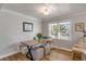 Well-lit dining room featuring bench seating, wood table, and views of the landscaped yard at 1200 Island View Dr, Mount Pleasant, SC 29464