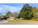 Charming single-story home with a beautiful front yard, mature trees, and a welcoming entrance at 1200 Island View Dr, Mount Pleasant, SC 29464