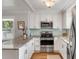 Bright kitchen featuring stainless steel appliances, granite countertops, and tiled backsplash at 1200 Island View Dr, Mount Pleasant, SC 29464