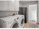 Functional laundry room equipped with a washer, dryer, and plenty of storage space at 1200 Island View Dr, Mount Pleasant, SC 29464