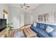 Cozy living room with a blue sectional couch and natural light from the window at 1200 Island View Dr, Mount Pleasant, SC 29464