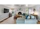 Cozy living room with a white brick fireplace, and comfortable light blue sectional couch at 1200 Island View Dr, Mount Pleasant, SC 29464