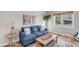 Comfortable living room with a blue couch, natural light, and view of the landscaped yard at 1200 Island View Dr, Mount Pleasant, SC 29464