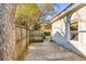 Fenced side yard featuring a small concrete patio and a gate leading to the backyard at 1200 Island View Dr, Mount Pleasant, SC 29464