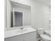 A well-lit bathroom offers a modern vanity, a sleek mirror, and a shower-tub combination at 123 Moscato Ln, Summerville, SC 29485