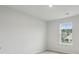 Bedroom with a double window overlooking a neighboring houses and landscaped backyard at 123 Moscato Ln, Summerville, SC 29485