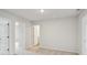 Bright bedroom with neutral carpeting and multiple entry doors to closet and bath at 123 Moscato Ln, Summerville, SC 29485