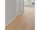 Light wood flooring and a glimpse of a sunlit room can be seen at the end of the hall at 123 Moscato Ln, Summerville, SC 29485
