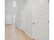 Bright hallway with light wood floors and white walls at 123 Moscato Ln, Summerville, SC 29485