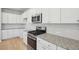 Bright kitchen featuring white cabinets, stainless steel appliances, and granite countertops at 123 Moscato Ln, Summerville, SC 29485