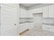 Kitchen featuring white cabinetry, granite countertops, and stainless steel hardware at 123 Moscato Ln, Summerville, SC 29485