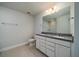 Bathroom with double sink vanity, granite countertops and a large mirror at 125 Royal Cainhoy Way, Huger, SC 29450
