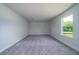 Spacious bedroom featuring plush carpeting and a large window with a scenic view at 125 Royal Cainhoy Way, Huger, SC 29450