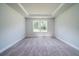 Comfortable bedroom with neutral carpet and a window with natural light at 125 Royal Cainhoy Way, Huger, SC 29450
