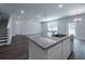 New kitchen with white cabinetry, stainless appliances, and granite countertops at 125 Royal Cainhoy Way, Huger, SC 29450