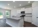 New kitchen with white cabinetry, stainless appliances, and granite countertops at 125 Royal Cainhoy Way, Huger, SC 29450