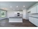 New kitchen with white cabinetry, stainless appliances, and granite countertops at 125 Royal Cainhoy Way, Huger, SC 29450