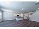 Open concept living area with wood-look flooring and recessed lighting at 125 Royal Cainhoy Way, Huger, SC 29450