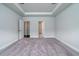 Spacious main bedroom with tray ceiling and carpet floors at 125 Royal Cainhoy Way, Huger, SC 29450