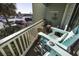 Balcony with blue Adirondack chairs, a small table, and views of the ocean at 1300 Ocean Blvd # 139, Isle of Palms, SC 29451